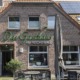 Außenansicht "Das Gasthaus am Reichswald" in Kranenburg-Frasselt mit Sitzgelegenheiten davor